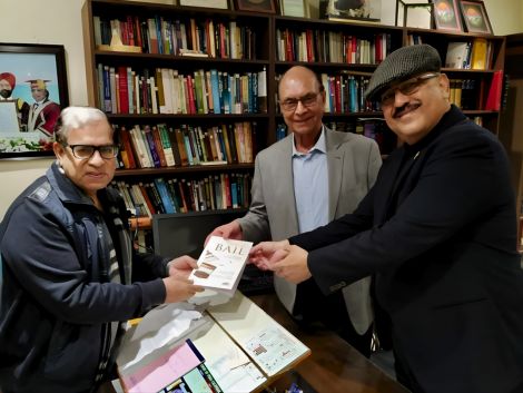 Presenting the book “Law of Bail” to retired Supreme Court judge Justice Sikri in his office.